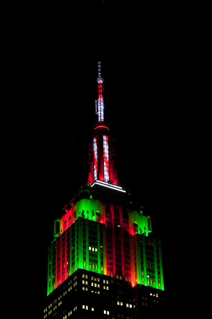 The Empire State Building tower lights celebrate the holiday season during a light show, Friday, December 20, 2013.